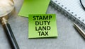 SDLT - Stamp Duty Land Tax write on a card on office desk Royalty Free Stock Photo