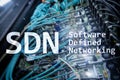 SDN, Software defined networking concept on modern server room background.