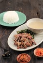 Se`i Sapi or Beef Sei is Indonesia Traditional Smoked Beef, Served with Boiled Cassava Leaves and Sambal Luat or Sambal Matah.