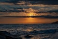 Sea against picturesque golden cloudy sky sunset on an amazing beach wallpaper Royalty Free Stock Photo