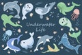 Sea animals set, cute baby whales, sharks, rays and jellyfish on a blue background with flowers and bubbles. Royalty Free Stock Photo