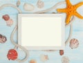 Sea background with frame and blue painted wood, rope, starfish, shells Royalty Free Stock Photo