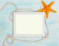 Sea background with frame and blue painted wood, rope, starfish, shells Royalty Free Stock Photo