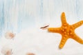 Sea background with white sand and blue painted wood, starfish, shells Royalty Free Stock Photo