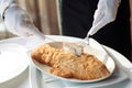 Sea bass baked in black salt on the white table Royalty Free Stock Photo