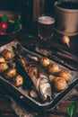 Sea Bass Baked with New Potatoes and Onion Royalty Free Stock Photo