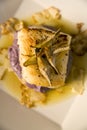 Sea bass on a bed of purple potato puree
