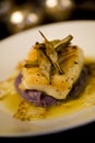 Sea bass on a bed of purple potato puree