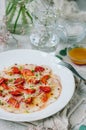 Sea bass carpaccio with baked strawberries and citrus dressing. Royalty Free Stock Photo