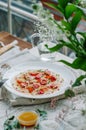 Sea bass carpaccio with baked strawberries and citrus dressing. Dish in the restaurant, strawberry menu. Summer light dish for Royalty Free Stock Photo