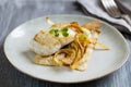 Sea bass fillet with parsnip crisps Royalty Free Stock Photo