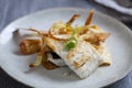 Sea bass fillet with parsnip crisps Royalty Free Stock Photo