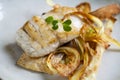 Sea bass fillet with parsnip crisps Royalty Free Stock Photo