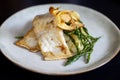 Sea bass fillet with parsnip crisps Royalty Free Stock Photo