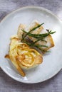 Sea bass fillet with parsnip crisps Royalty Free Stock Photo