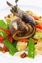 Sea bass fillet with spring vegetables Royalty Free Stock Photo