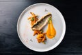 Sea bass with vegetables stir fry, seared sea bass served with stir fried baby vegetables, healthy lunch or dinner Royalty Free Stock Photo