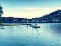 Sea bay with calm surface, anchored yachts