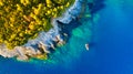 A sea bay. Clear turquoise water and a boat. View from the air. Summer landscape from a drone.