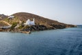 Sea bay and Greek church on the cliff, Ios island. Cyclades, Greece Royalty Free Stock Photo