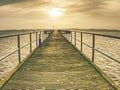 Sea bay, sun daylight relaxation landscape and wooden bridge Royalty Free Stock Photo