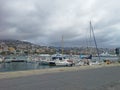 Sea bay with yachts and boats at cloudy day in San Remo, Italy, view from city Sanremo, Italian Riviera Royalty Free Stock Photo