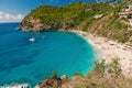 Sea beach with blue water, white sand and mountain landscape in gustavia, st.barts. Summer vacation on tropical beach Royalty Free Stock Photo