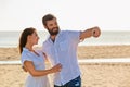 On sea beach loving couple take selfie by mobile phone Royalty Free Stock Photo