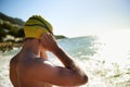 Sea, beach and man for swimmer exercise, nature workout or outdoor practice in ocean, sea or water waves. Swimwear Royalty Free Stock Photo