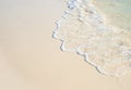 Sea beach with smooth wave photo background. Coral beach sand with sea tide.