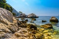 Sea beach with stones and rocks, Beausoleil, Nice, Nizza, Alpes-Maritimes, Provence-Alpes-Cote d `Azur, Cote d `Azur, French Rivie Royalty Free Stock Photo