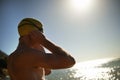 Sea, beach sunset and man for swimmer exercise, workout or outdoor training in ocean, nature or water. Mockup space Royalty Free Stock Photo