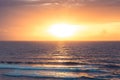 Sea beach surf waves Bali beach Uluwatu surfing spot sunset landscape with cliff view on sea horizon with sun and orange sky as tr