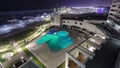 Sea beach, swimming pool and yacht in the sea at night timelapse. Top view