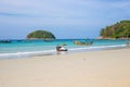 Sea beach on a tropical island. Boats in the sea for the entertainment of tourists. Thailand, Phuket