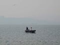 Sea blue fishing hunter boat bird city Royalty Free Stock Photo