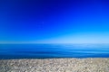The deep blue sky of the sea shore stones