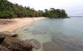 Sea, blue sky, palms and boats in White beach, Sabang, Puerto Galera, Philippines. Popular tourist and diving spot. Royalty Free Stock Photo