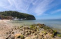 Sea, blue sky, palms and boats in White beach, Sabang, Puerto Galera, Philippines. Popular tourist and diving spot. Royalty Free Stock Photo