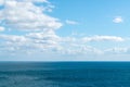 Sea and blue sky with white clouds skyline