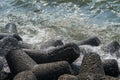 Sea blue waves crashing on rocks at the coast Royalty Free Stock Photo