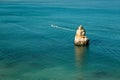 A sea boat sails along the Atlantic Ocean off the coast of Portugal.