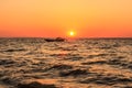 Sea and boat at sunset