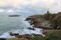 Sea breaking on rocks and lighthouse Royalty Free Stock Photo