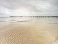 Sea Bridge above the Baltic Sea. Sun hidden at misty horizon, Royalty Free Stock Photo