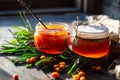 Sea buckthorn jam in glass jars, branch and berries Royalty Free Stock Photo