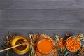 Sea buckthorn juice or tea with honey on a black wooden background with copy space for your text. Top view Royalty Free Stock Photo