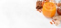 Sea buckthorn smoothie with ginger, honey and cinnamon. Web banner with copy space Royalty Free Stock Photo