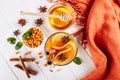 Sea buckthorn tea in wooden bowl, honey, Sea buckthorn juice on white wooden table. top view with copy space Royalty Free Stock Photo