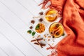 Sea buckthorn tea in wooden bowl, honey, Sea buckthorn juice on white wooden table. top view with copy space for text Royalty Free Stock Photo